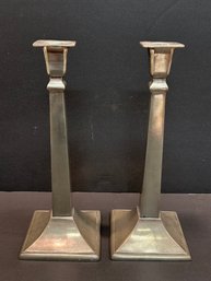 A Pair Of Pewter Arte Italica Candlesticks