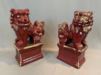 Pair Of Chinese Ceramic Foo Dogs On Pedestals
