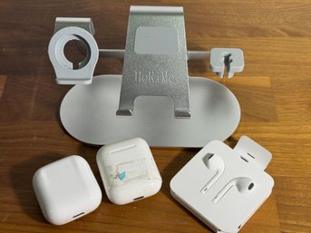 Docking Station And Three Ear Buds Two Apple