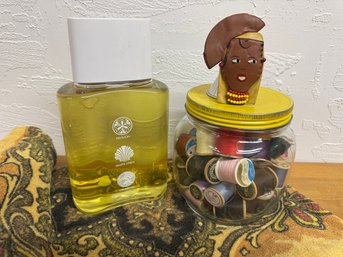 Vintage Thread Jar With A Vintage Towel And Vintage Lady Pin And Este Lauder Factice Bottle