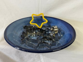 Blue Bowl Plater With An Assortment Of Cookie Cutters