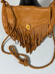 Soft And Supple Fringed Purse With Braided Strap And Bone Button