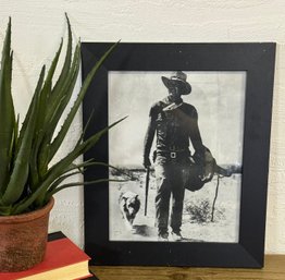 John Wayne With A Dog Framed Art