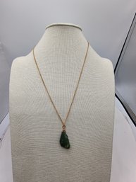 Jade Pendant Necklace Featuring A Natural Stone On A Gold-toned Chain