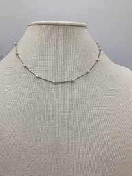 Silver-tone Necklace Featuring Small Beads Spaced Along A Delicate Chain