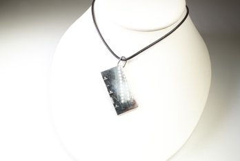 Hermes Silver-Tone Rectangular Tag Pendant Necklace On Black Leather Cord