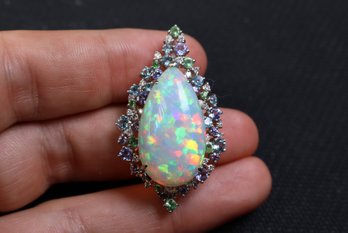 Platinum, Ethiopian Opal, Diamond, Grossular Garnet, Tanzanite, Topaz Pendant 13.79ctw, 12.4 Grams Jewelry