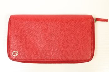 Gucci Red Pebbled Leather Zip Around Wallet Featuring A Small Interlocking G Logo