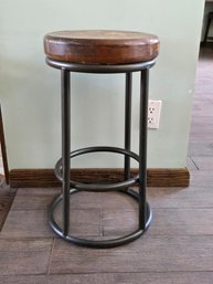 Industrial-style Counter Stool With A Solid Wood Seat And A Black Iron Metal Frame.