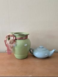 Vintage Green Ceramic Pitcher Adorned With A Decorative Ribbon And A Smaller Light Blue Crackled Glaze Teapot