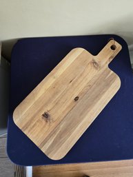 Charcuterie Board Featuring A Handle With A Hanging Loop.
