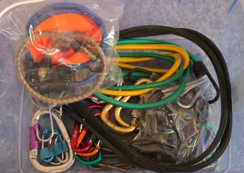 V6 Collection Of Utility Gear, Including Various Bungee Cords, Carabiners, And Rope Tools