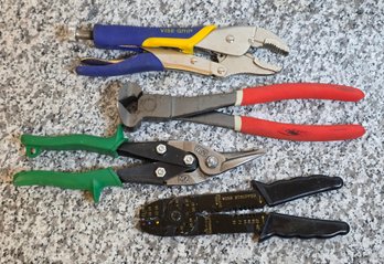 R297 Collection Of Four Hand Tools Designed For Gripping, Cutting, And Electrical Work