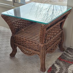 Brown Wicker End Table With A Glass Tabletop