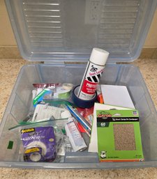 Clear Plastic Storage Container Filled With Various Household And Craft Supplies