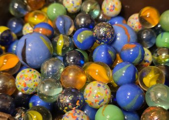 Collection Of Vintage-style Glass Marbles, Often Referred To As 'cat's Eyes'