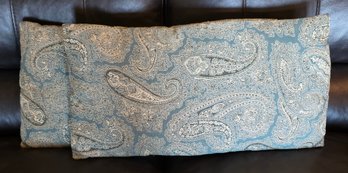Decorative Throw Pillow Features A Traditional Paisley Pattern In Blue And Cream Colors
