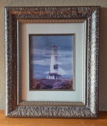 Framed Fine Art Print Depicting A Lighthouse On A Rugged Coastline