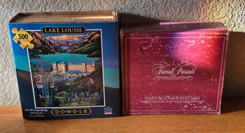 500-piece Dowdle Folk Art Jigsaw Puzzle Titled 'Lake Louise' And A Trivial Pursuit 'Baby Boomer Edition'