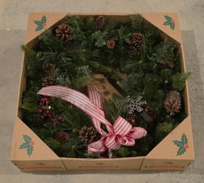 Holiday Wreath Is From Ashland, Featuring A Vibrant Red Bow And Pinecones