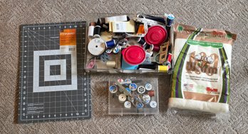 Assortment Of Sewing Essentials And Storage Solutions