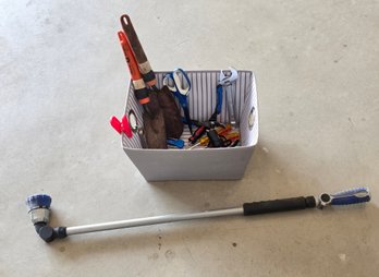 Fabric Storage Bin Used For Gardening Tool Organization, Along With A Long-handled Watering Wand