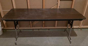 Rectangular Folding Banquet Table Featuring A Woodgrain Laminate Top And Adjustable Steel Legs