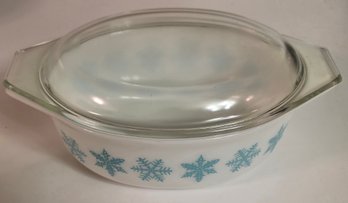 Vintage Pyrex Casserole Dish Featuring The Turquoise 'Snowflake' Pattern On A White Background
