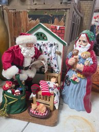 Two Santa Figurines