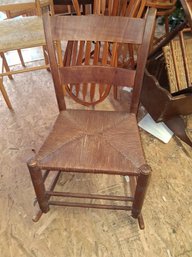 Antique Rocking Chair With A Wicker Seating