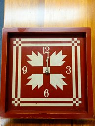 Rustic Wooden Wall Clock Featuring A Red And Cream Bear's Paw Quilt Block Design