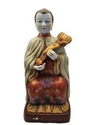 Chinese Porcelain Statue Of An Immortal Or Deity Holding A Ruyi Scepte