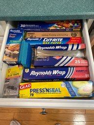 Drawer Full Of Aluminum Foil Plastic Wrap Wax Paper Glue Traps Oven Bags Etc.