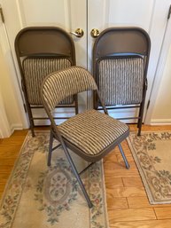 4 Folding Chairs. 3 Are Shown But There Are 4