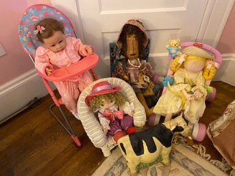 Four Dolls In Chairs And Cow Doorstop