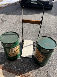 Two Green Barrels And Hand Truck (DN23)