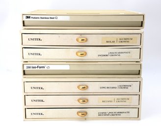 Collection Of 3M Unitek Dental Crowns In A Storage Organizer.