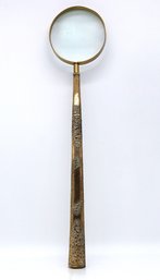 Large Antique Magnifying Glass Featuring A Rolled Gold Tone Handle