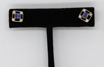Oval Tanzanite With Four Diamonds Surround Each Corner In 18k Earrings