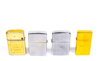 Group Of Four Vintage Zippo & Storm Master Lighters, 14k Gold & Chrome Finish, USA