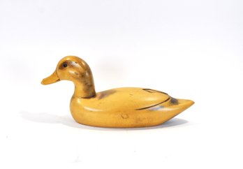 Vintage Hand-Carved Wooden Duck Decoy With Stylized Wing Mark