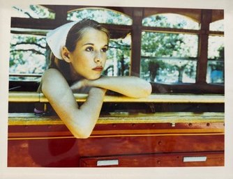 Framed Photograph Of A Young Woman On A Trolley