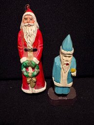 Two Carved Santa Ornaments