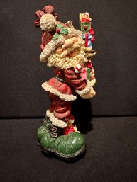 Santa Having Fun Carrying The Gifts