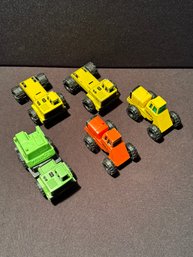 Five Toy Construction Vehicles