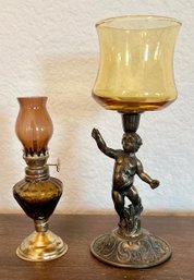 Metal Cherub Base And Amber Glass Candle Holder With A Miniature Ambler Glass Oil Lamp