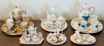 (6) Miniature Ceramic Teapot Sets With Trays, Teapots, Cups, Saucers, Cream, Sugar