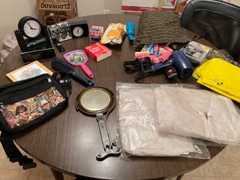 Box Full Of Hair Styling Accessories And Rain Outfits
