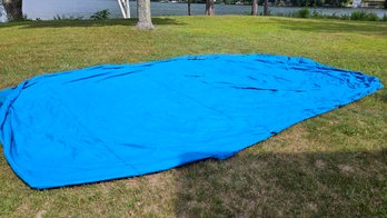 Lot 6-223 Boat Cover Large (300801).  (above Tan Cabinet)
