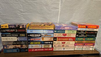 Lot 6-329 Paperback Books McNaughton, Grafton, Etc.